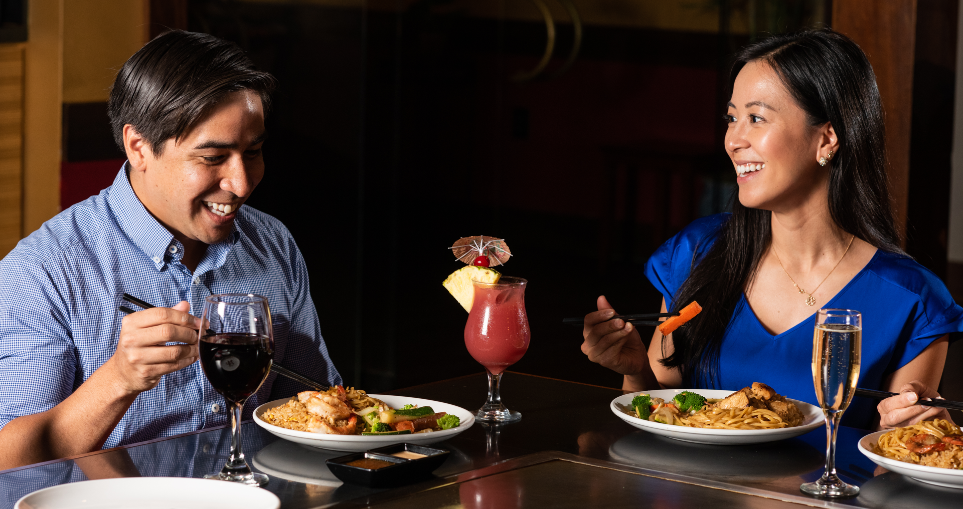 Promotions Banner. Two guests enjoying Teppanyaki dining at Kobe.
