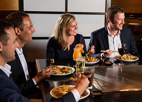hibachi st. pete Private Events Image Corporate team having food in a company meeting conducted at Kobe Steakhouse