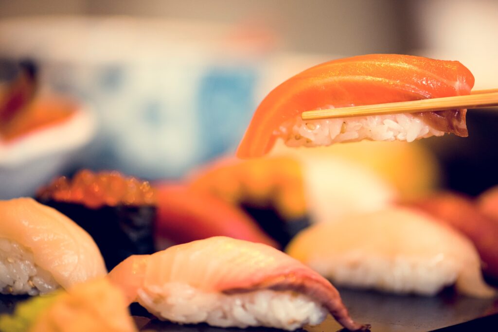 Nigiri being picked up by chopsticks