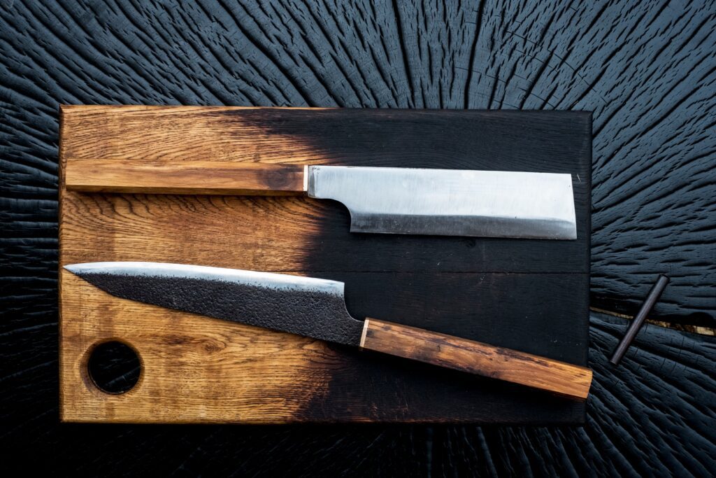 Two types of Japanese knives on a cutting board