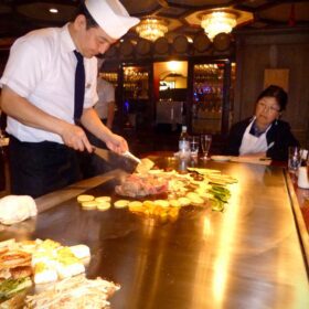 Teppanyaki chef training on a proper teppanyaki board